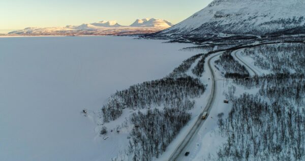Truck Lapporten mountains and lake Tornetrask winter 01