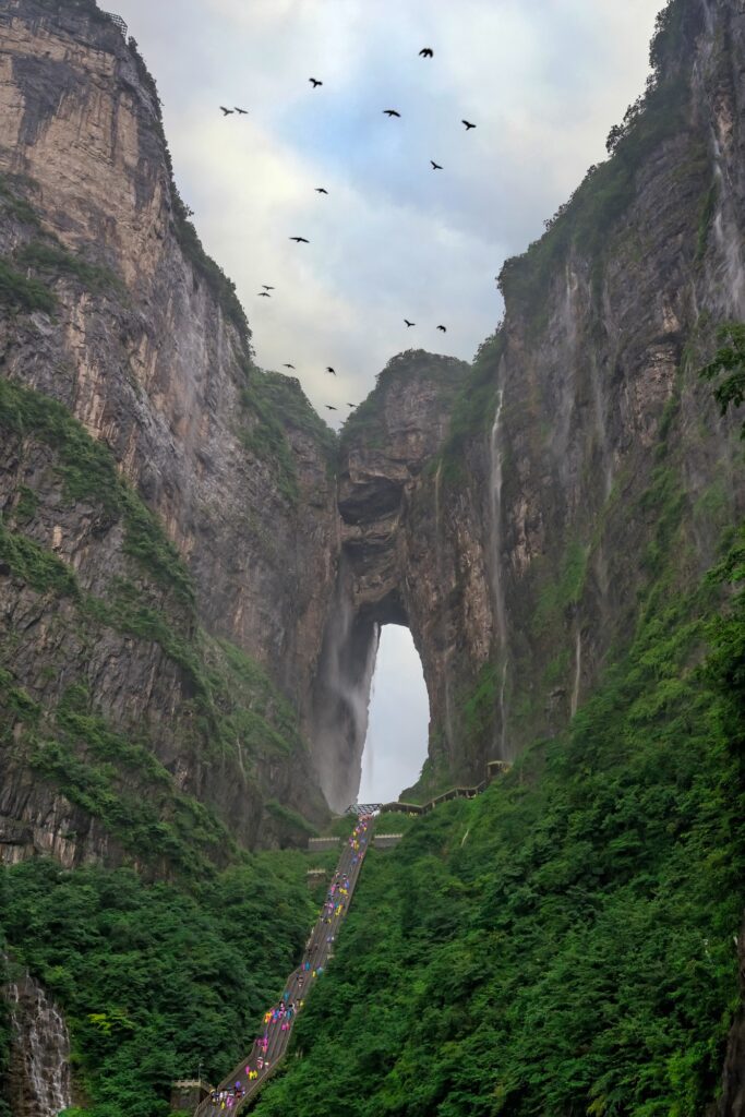 Birds flying over Holy Tianmen Mountain