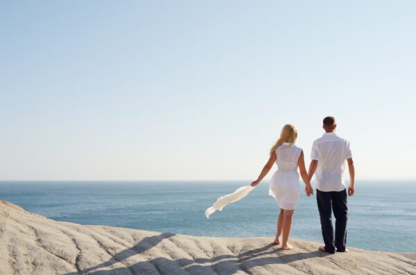 Loving couple looking at the sea